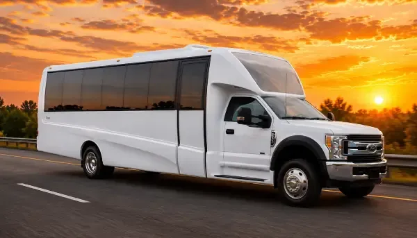 White-painted 18 Passenger Party Bus ready for booking