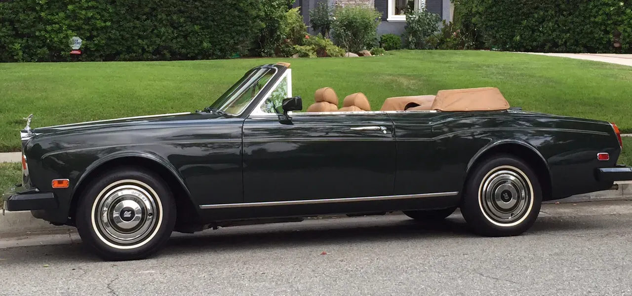 Green 1983 Rolls-Royce Corniche Convertible exterior with convertible roof, photo 11 for wedding car rental in Reseda, CA