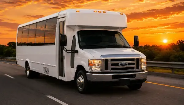 White-painted 20 Passenger Party Bus ready for booking