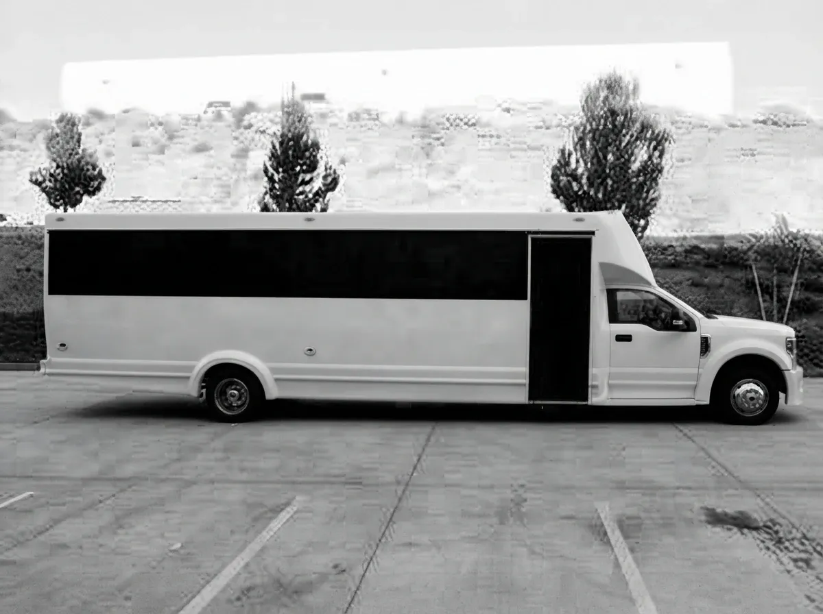White-painted 2019 Ford F550 30 Passenger Luxury Limousine Bus ready for booking