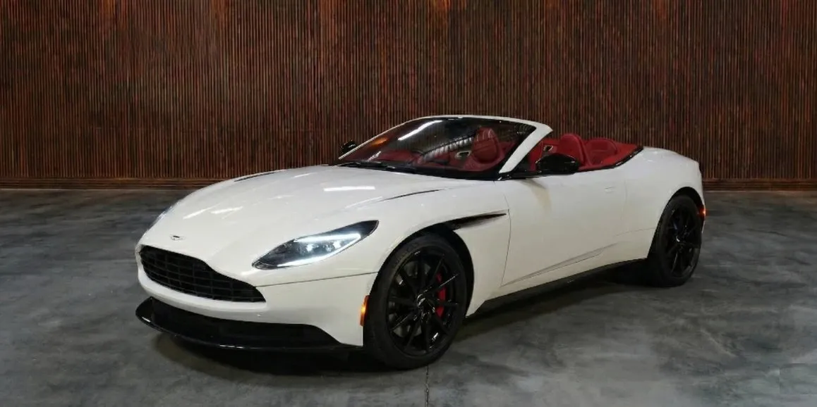 White Aston Martin DB11 exterior with convertible roof for wedding car rental in Toms River, NJ White Aston Martin DB11 exterior with convertible roof for wedding car rental in Toms River, NJ