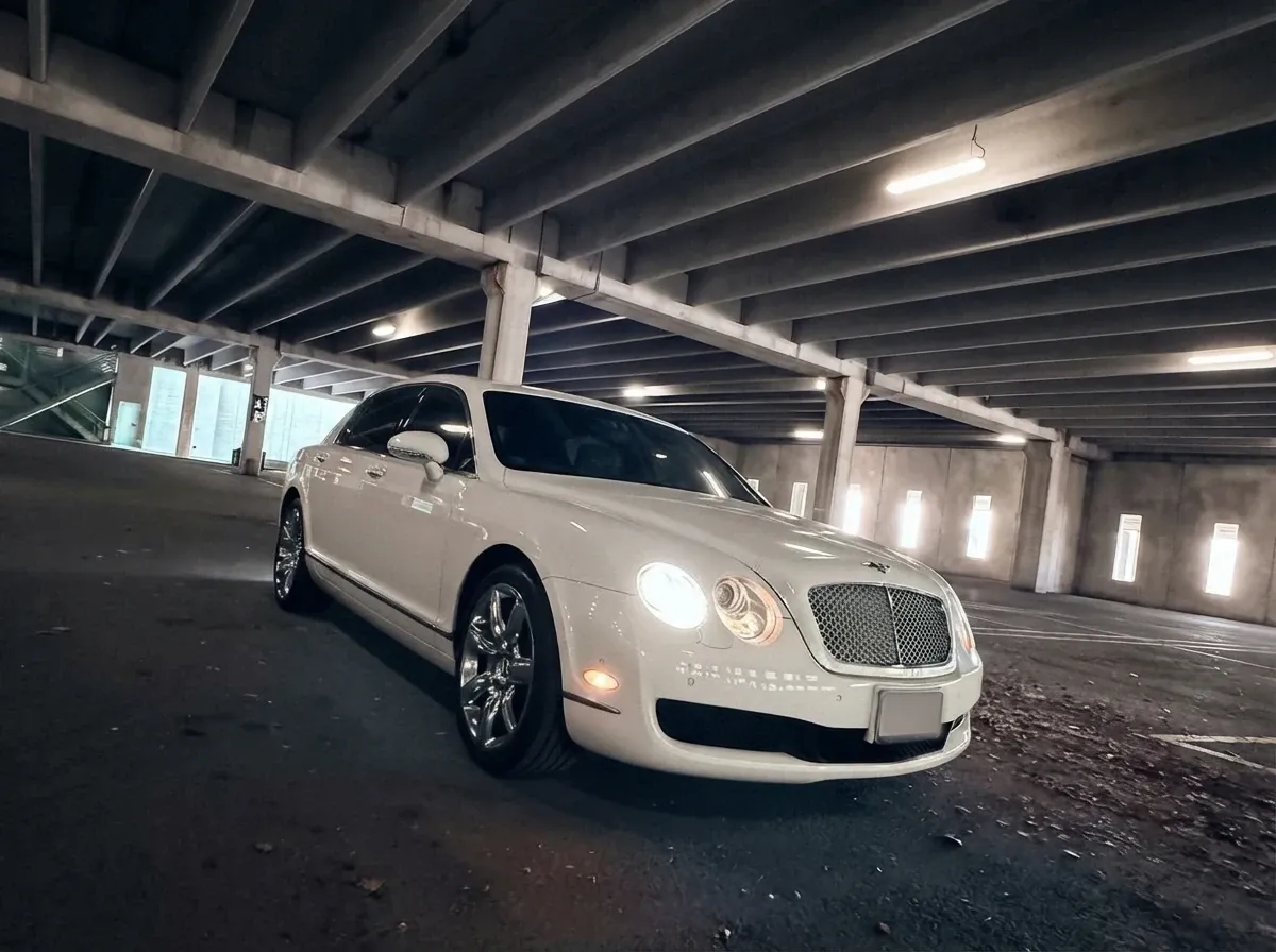 White-painted Bentley Continental Flying Spur ready for booking