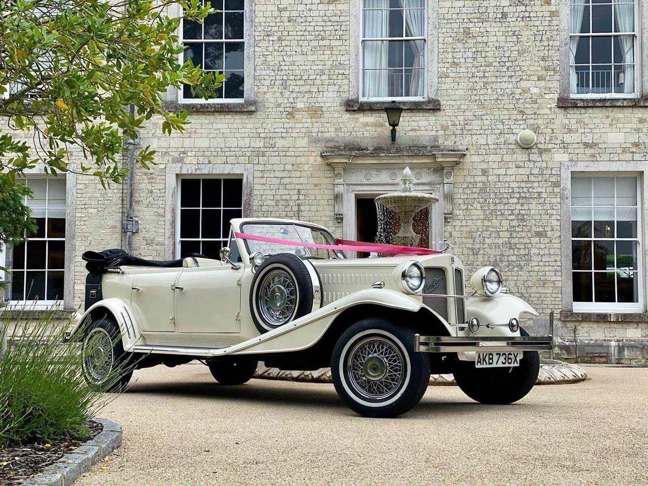 White Beuford 1920 with convertible roof for wedding car rental in Archer City, TX