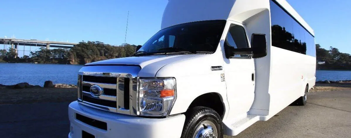 White Ford F-550 Party Bus exterior with tinted windows for party bus rental in North Attleboro, MA