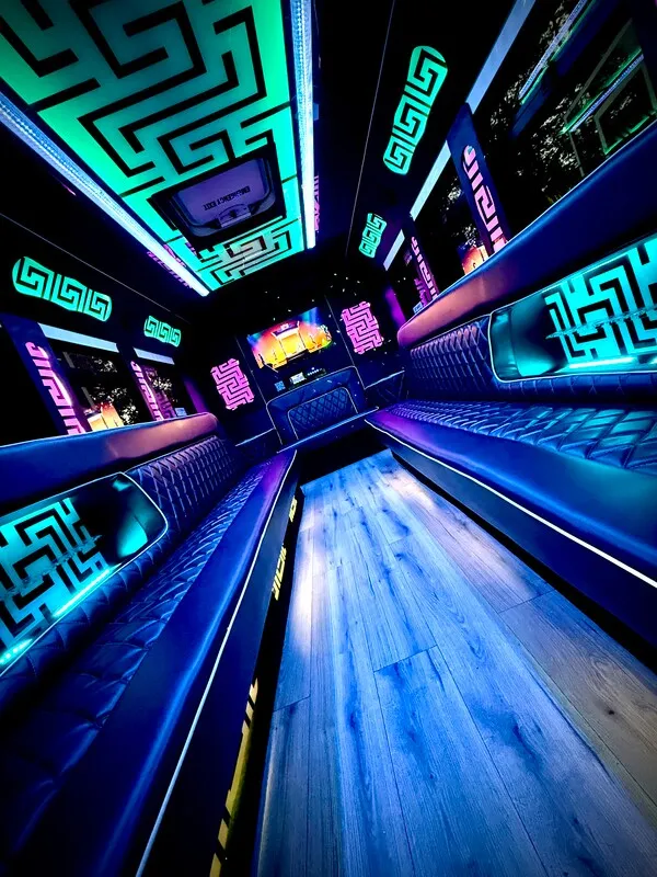 Ford E-450 Series Party Bus interior with perimeter lounge seating, LED accent lighting and LED ceiling lighting for party bus rental in North Attleboro, MA Ford E-450 Series Party Bus interior with perimeter lounge seating, LED accent lighting and LED ceiling lighting for party bus rental in North Attleboro, MA