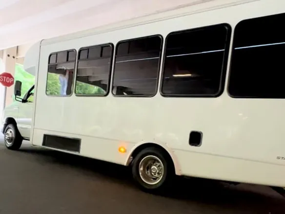 Ford E-450 Series Party Bus White-painted Ford E-450 Series Party Bus, tinted windows