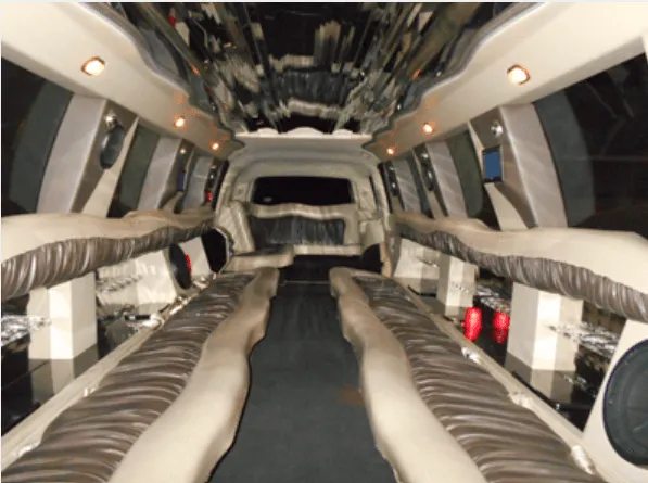 Cadillac Escalade Limousine, inside view, perimeter lounge seating and mirrored ceiling