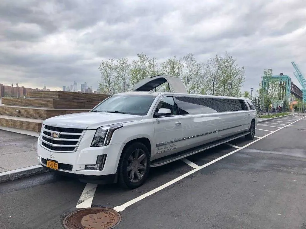 White Cadillac Escalade Limousine with tinted windows for limo rental in Montville, NJ