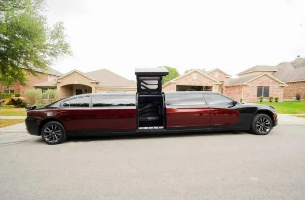Black Charger Limousine with tinted windows and bridal (jet) door for limo rental