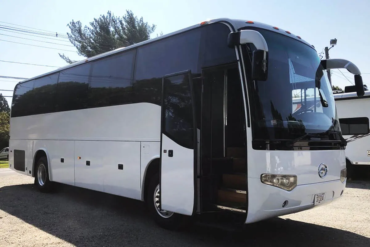 Entertainment Coach exterior with tinted windows for party bus rental in North Attleboro, MA Entertainment Coach exterior with tinted windows for party bus rental in North Attleboro, MA