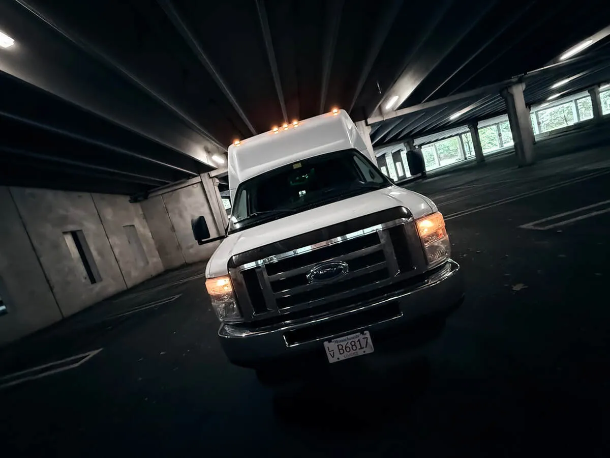 White Ford E-450 Series Party Bus exterior for party bus rental in North Attleboro, MA