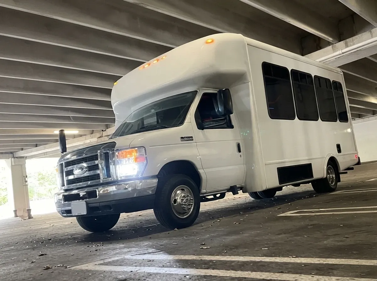 White-painted Ford E-450 Series Party Bus ready for booking