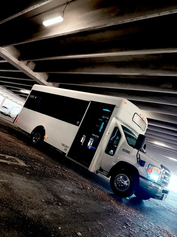 White Ford E-450 Series Party Bus exterior, photo 8 for party bus rental in North Attleboro, MA White Ford E-450 Series Party Bus exterior, photo 8 for party bus rental in North Attleboro, MA