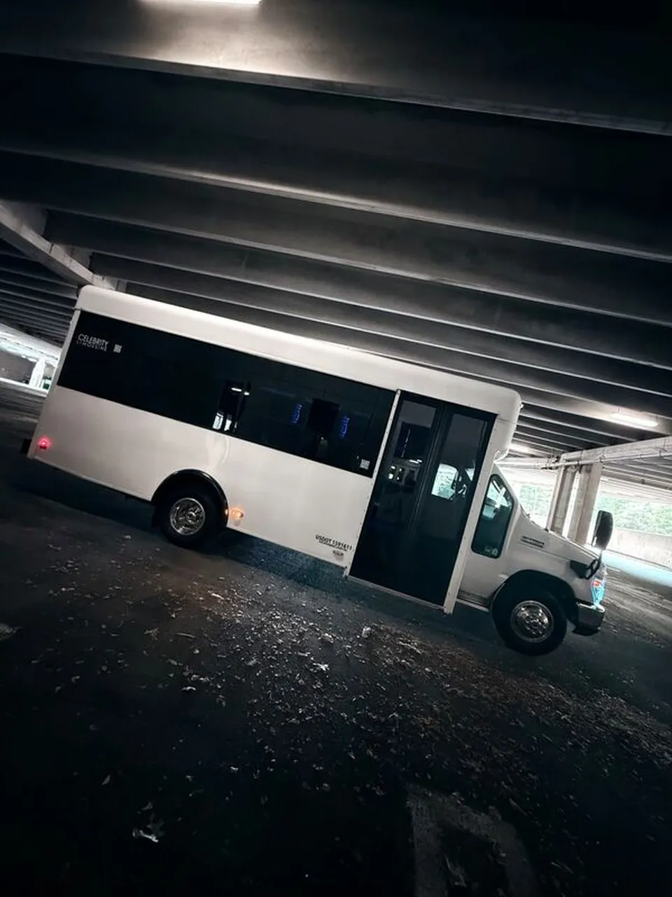 White Ford E-450 Series Party Bus exterior for party bus rental in North Attleboro, MA White Ford E-450 Series Party Bus exterior for party bus rental in North Attleboro, MA