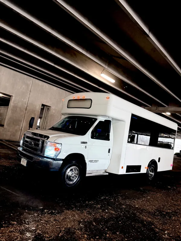 White Ford E-450 Series Party Bus exterior, photo 4 for party bus rental in North Attleboro, MA White Ford E-450 Series Party Bus exterior, photo 4 for party bus rental in North Attleboro, MA
