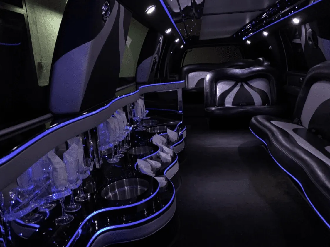 Ford Excursion Limousine Ford Excursion Limousine interior with LED accent lighting and bar area for limo rental