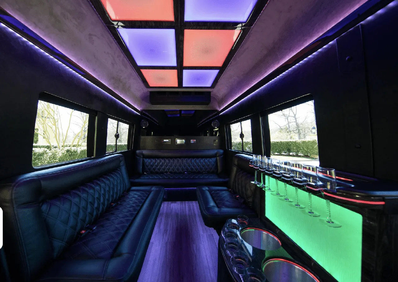 Ford Limousine Van interior with sofa-style seating, LED accent lighting and LED ceiling lighting for party bus rental in Charlottesville, VA