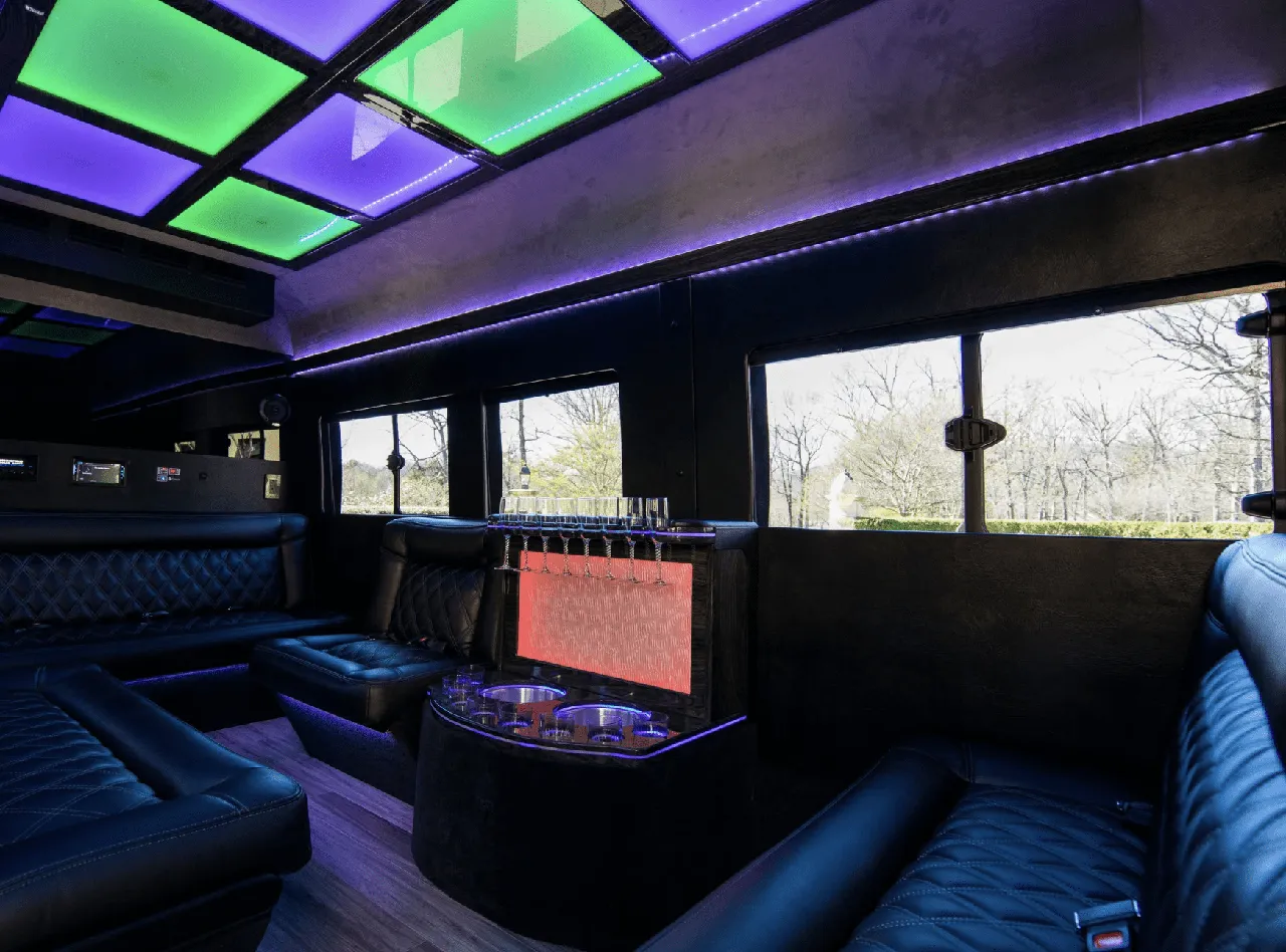 Ford Limousine Van interior with sofa-style seating, LED accent lighting and LED ceiling lighting, photo 2 for party bus rental in Charlottesville, VA