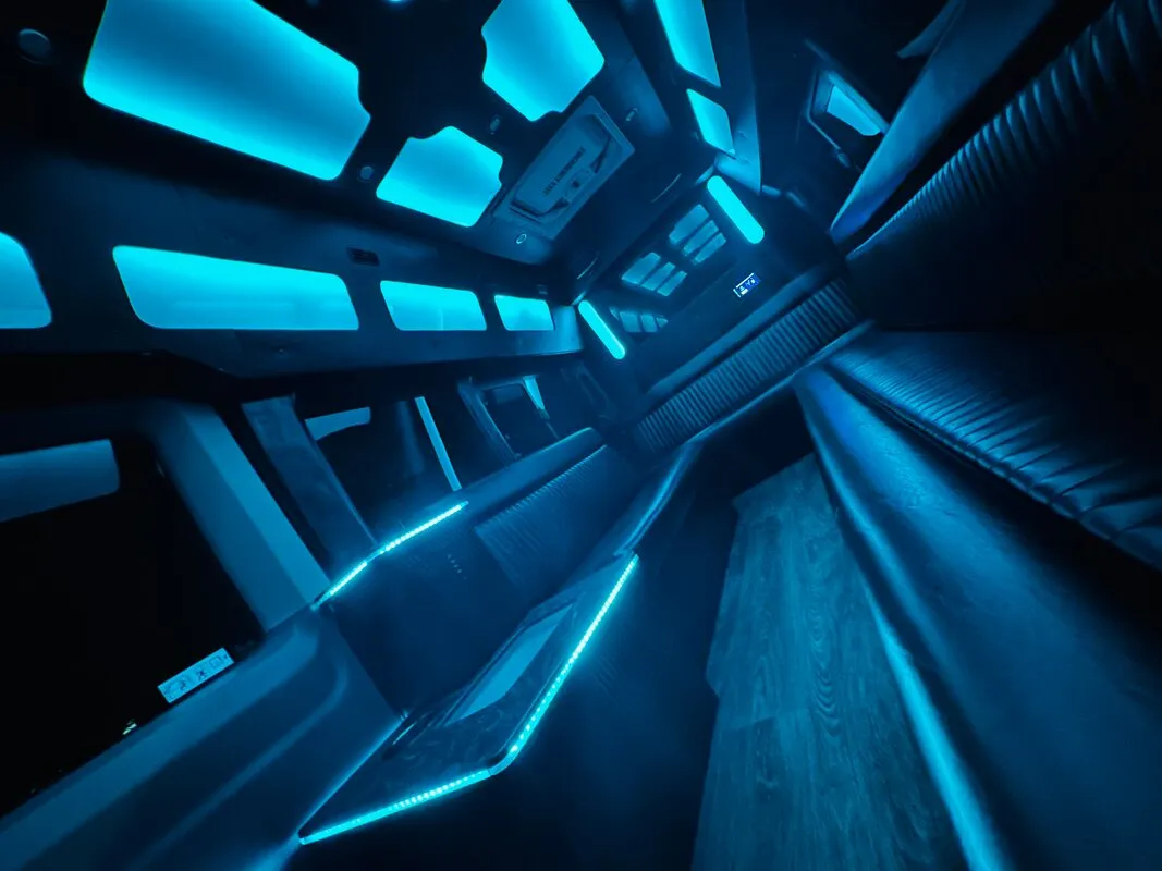 Ford Transit VAN interior with perimeter lounge seating, LED accent lighting and LED ceiling lighting, photo 4 for party bus rental