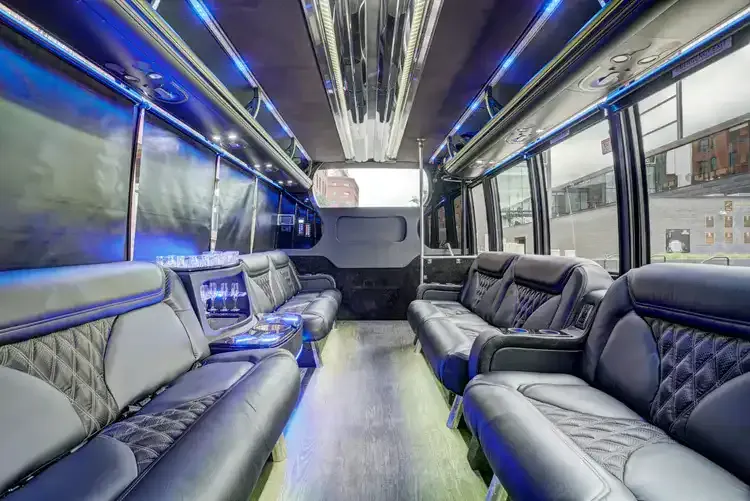 Grech Party Bus interior with perimeter lounge seating, sofa-style seating and LED accent lighting, photo 2 for party bus rental