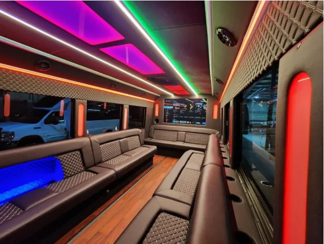 22 Passenger Limo Bus 22 Passenger Limo Bus interior with perimeter lounge seating, LED accent lighting and LED ceiling lighting for party bus rental