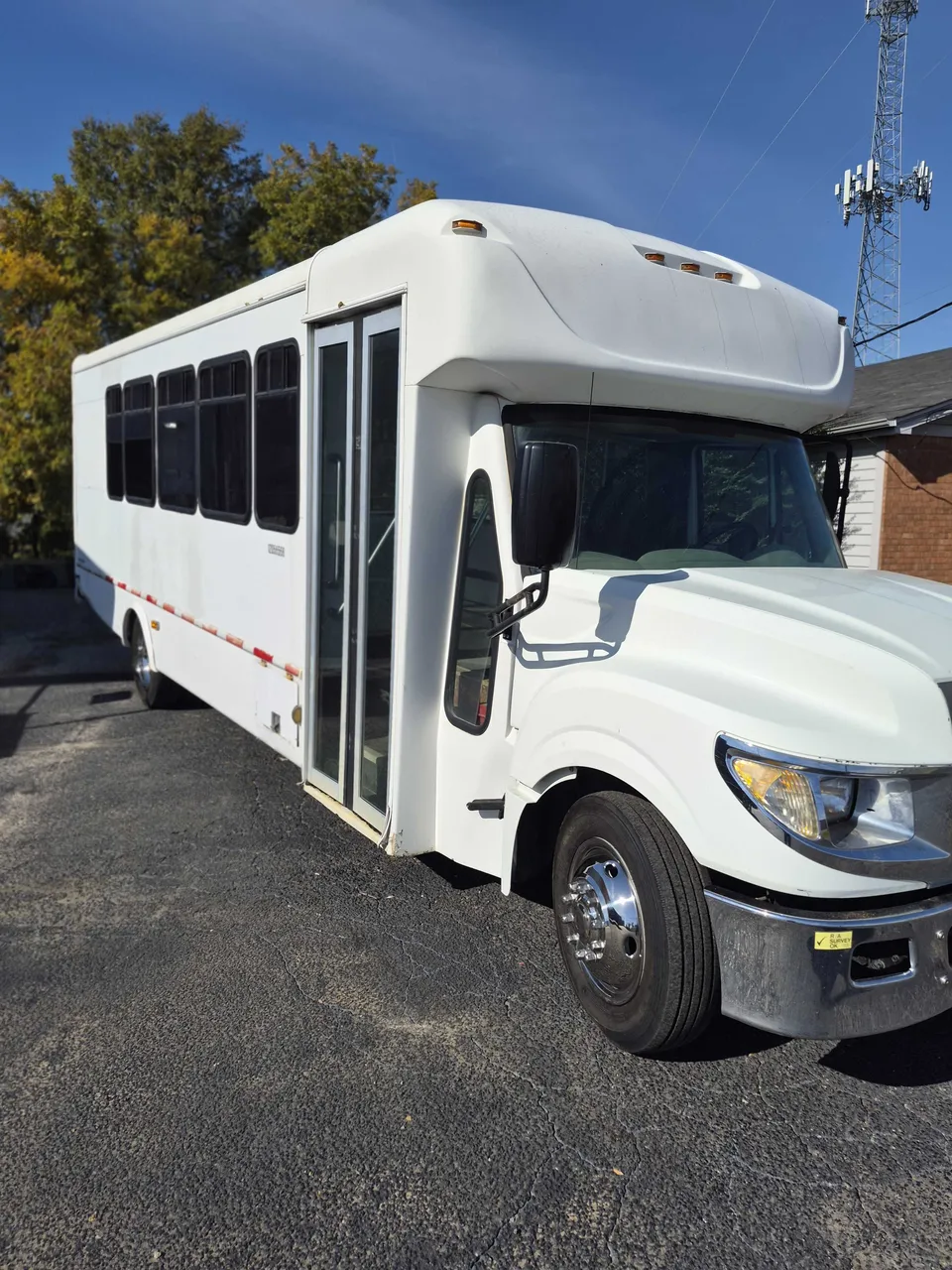 Silver Limousine Bus exterior with tinted windows, photo 4 for party bus rental in Memphis, TN