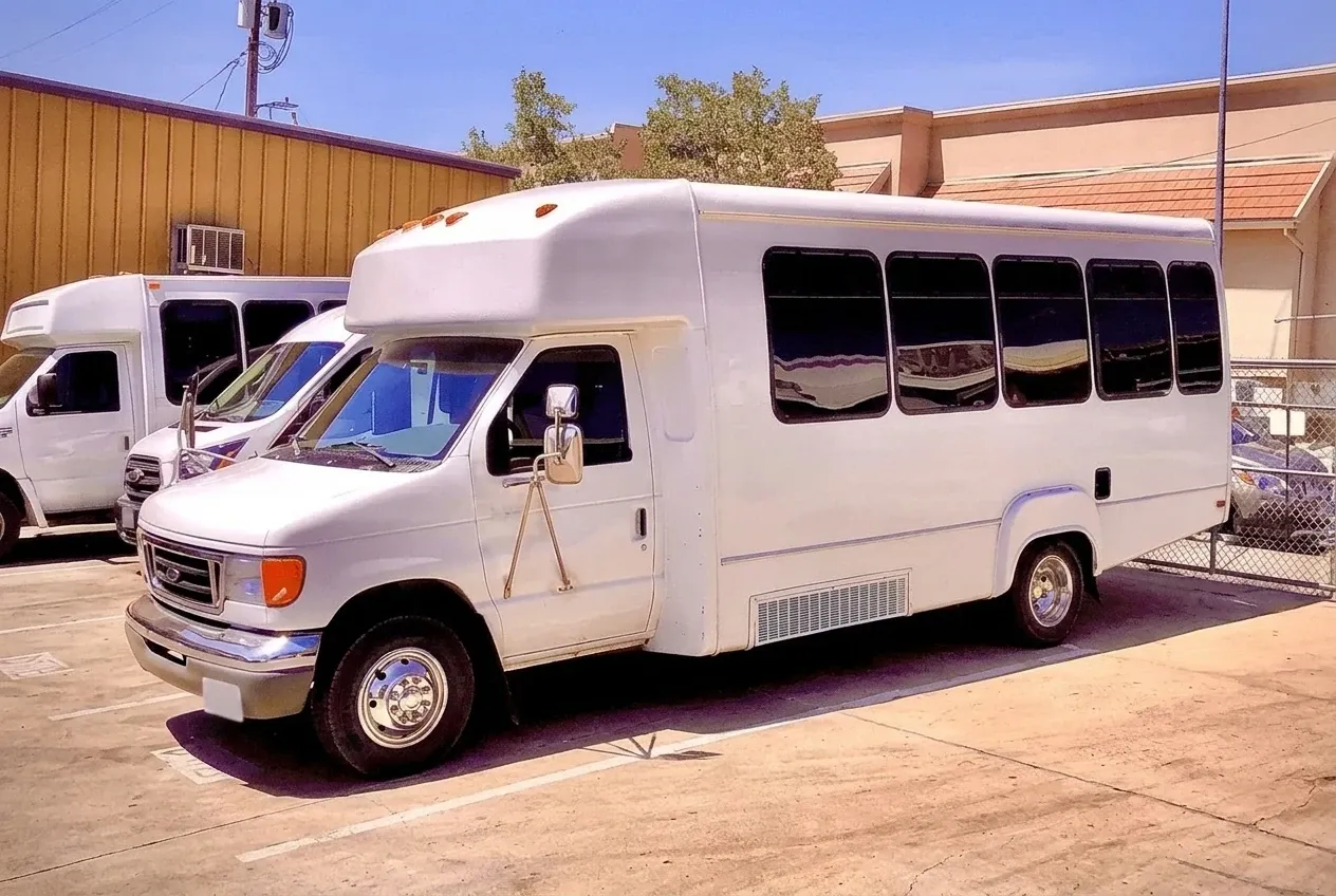 White-painted Limousine Party Bus ready for booking
