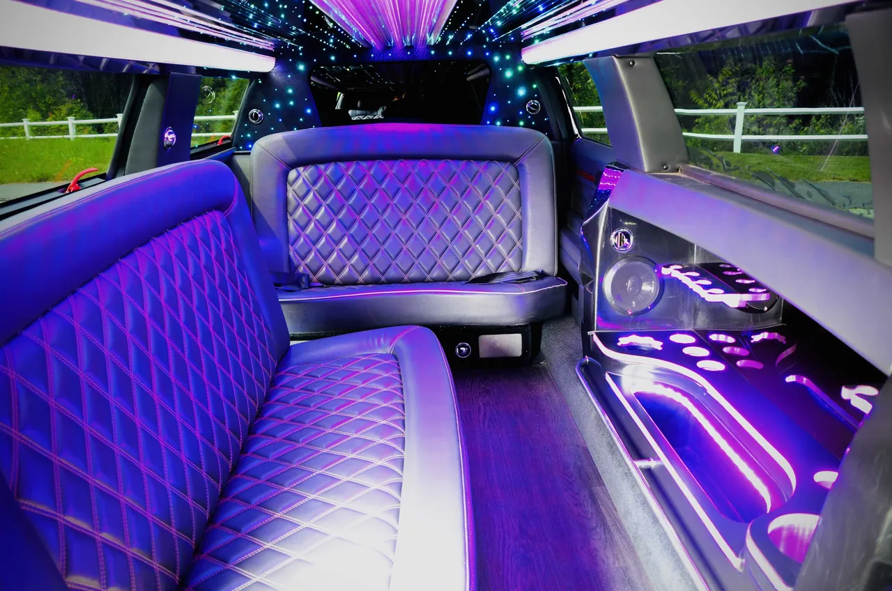Lincoln MKT Limousine interior with LED accent lighting, LED ceiling lighting and starlight or fiber-optic ceiling for limo rental