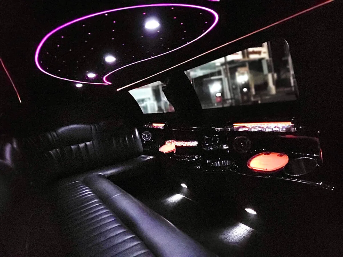 Lincoln Town Car Limousine interior with perimeter lounge seating and starlight or fiber-optic ceiling, photo 8 for wedding car rental in North Attleboro, MA