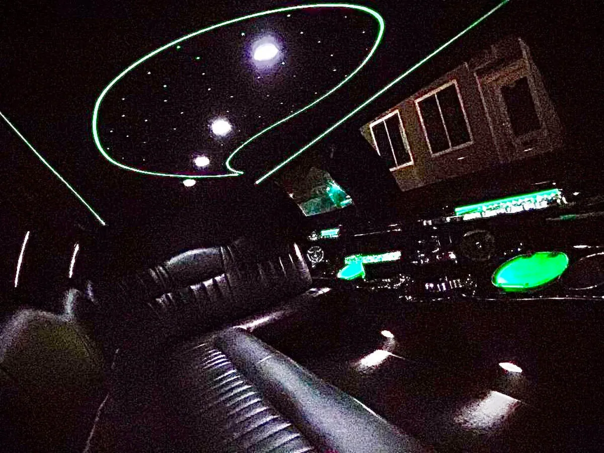 Lincoln Town Car Limousine interior with perimeter lounge seating and starlight or fiber-optic ceiling for wedding car rental in North Attleboro, MA