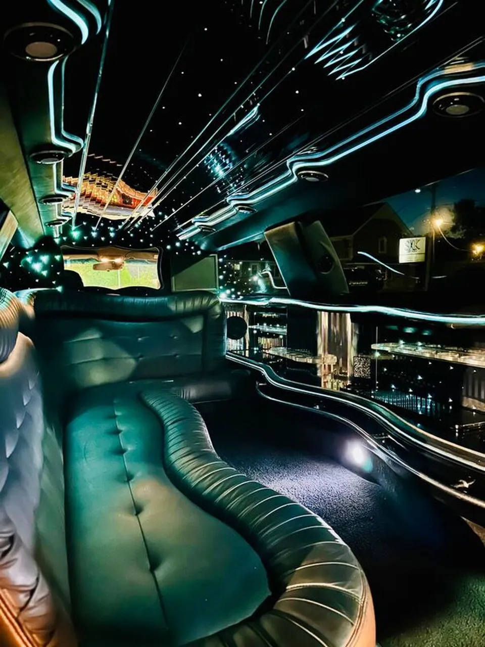 Lincoln Town Car Limousine interior with sofa-style seating, LED accent lighting and starlight or fiber-optic ceiling, photo 11 for limo rental
