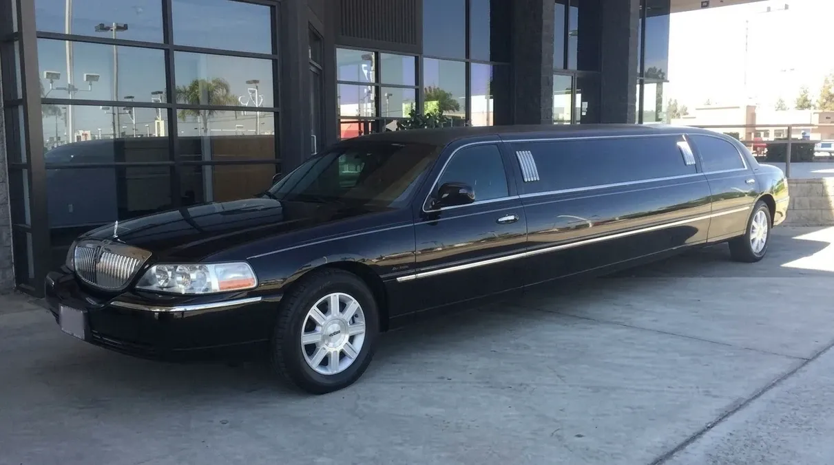Black-painted Lincoln Town Car Limousine ready for booking
