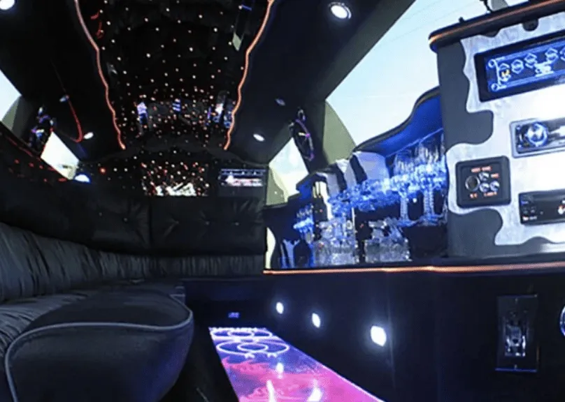 Lincoln Towncar Limo Tuxedo interior with LED accent lighting, starlight or fiber-optic ceiling and lit dance floor for limo rental in Jackson County, CO