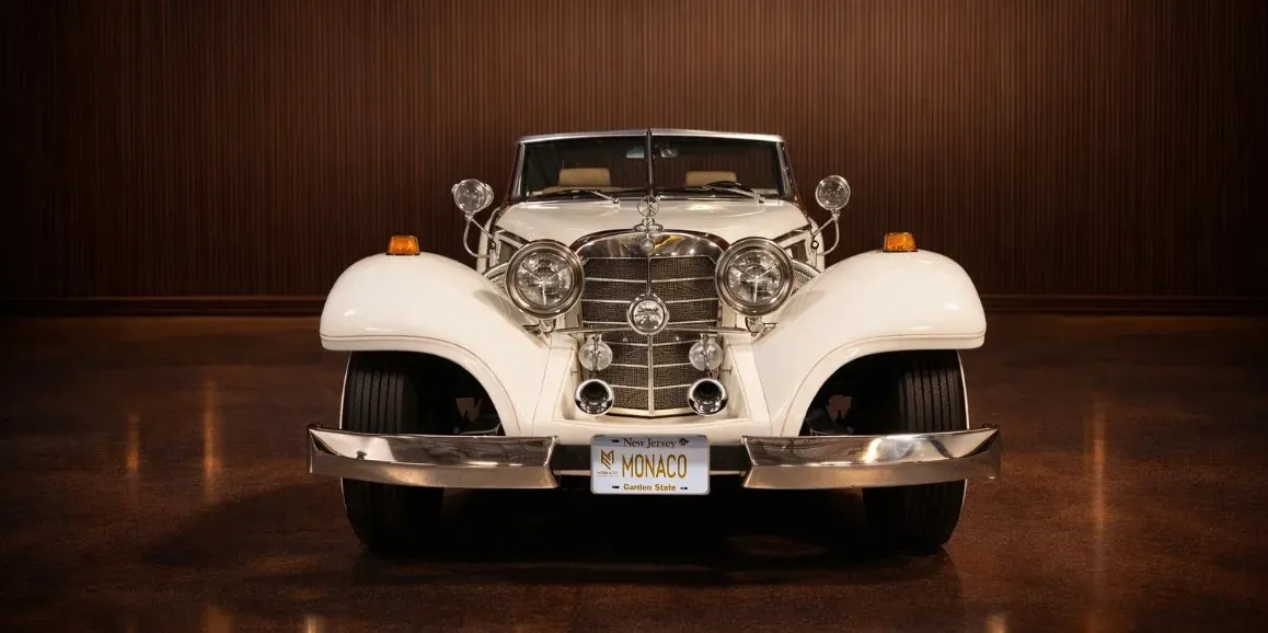 White Mercedes-Benz 500K exterior with convertible roof for wedding car rental