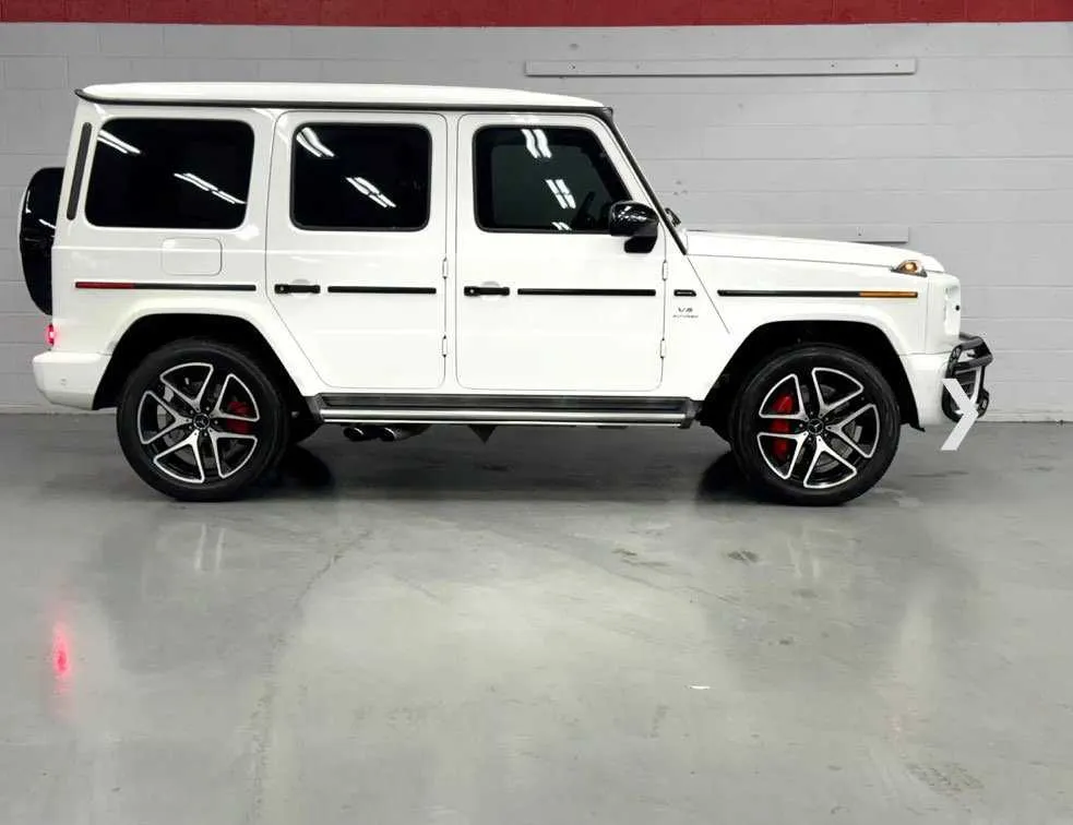 White Mercedes-Benz G Wagon exterior with running boards for wedding car rental in Southfield, MI