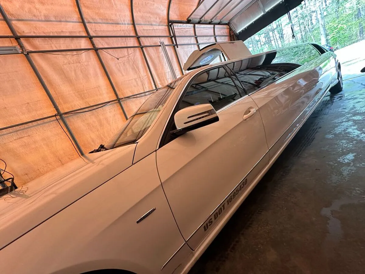 White Mercedes-Benz Jet Doors Limousine exterior with tinted windows for wedding car rental in North Attleboro, MA