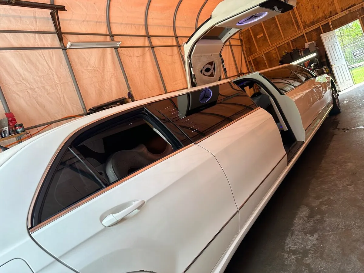 White Mercedes-Benz Jet Doors Limousine exterior with tinted windows and bridal (jet) door for wedding car rental in North Attleboro, MA