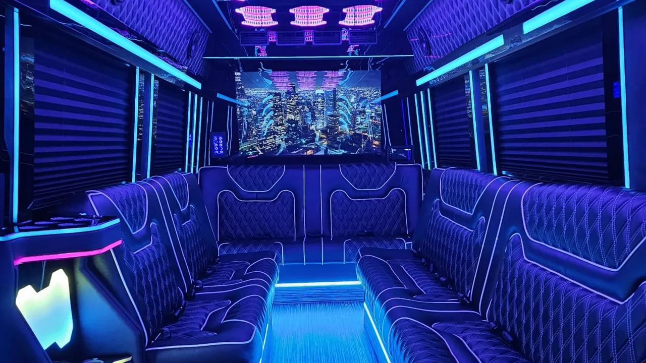 Mercedes Limo Sprinter interior with perimeter lounge seating, sofa-style seating and window shades for party bus rental in Rensselaer County, NY
