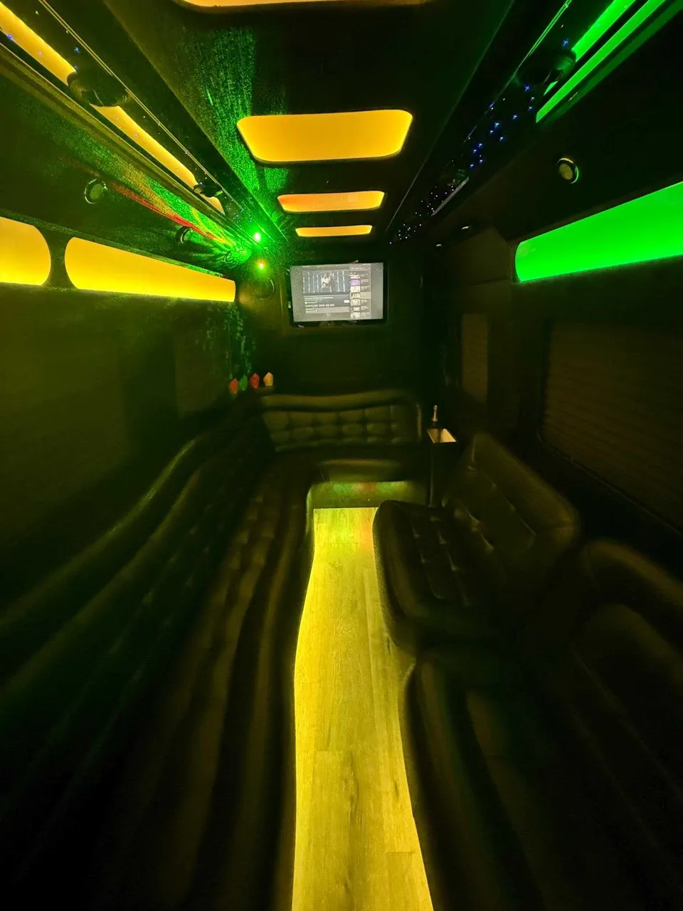 Mercedes Limo Sprinter interior with perimeter lounge seating, LED accent lighting and LED ceiling lighting, photo 3 for party bus rental in Luzerne County, PA