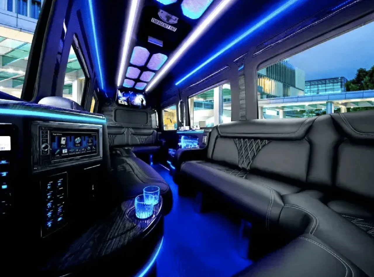 Mercedes Limo Sprinter interior with sofa-style seating, LED accent lighting and LED ceiling lighting for party bus rental in Long Barn, CA