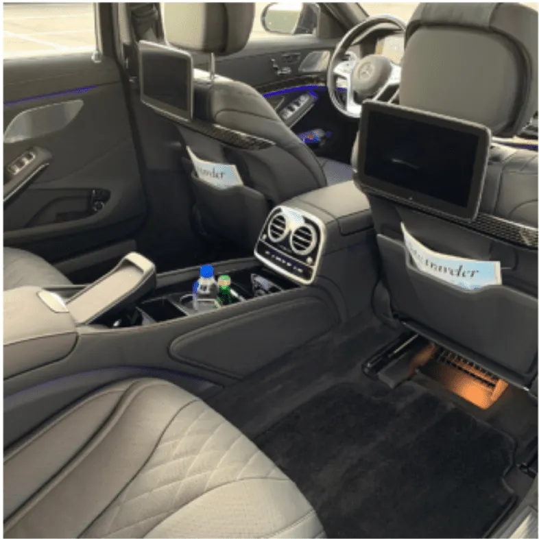 Mercedes-Maybach Mercedes-Maybach interior with cup holders, LED accent lighting and rear-seat entertainment screens for wedding car rental