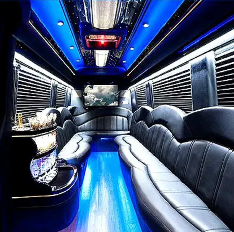 Mercedes-Benz Sprinter Limousine interior with perimeter lounge seating, sofa-style seating and window shades for party bus rental