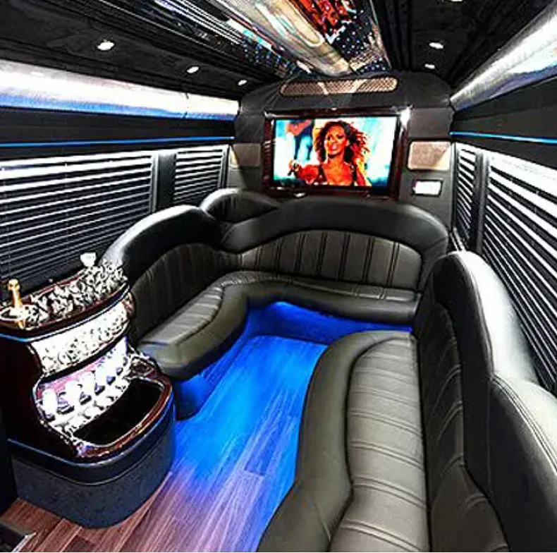 Mercedes-Benz Sprinter Limousine Mercedes-Benz Sprinter Limousine interior with perimeter lounge seating, window shades and LED accent lighting for party bus rental
