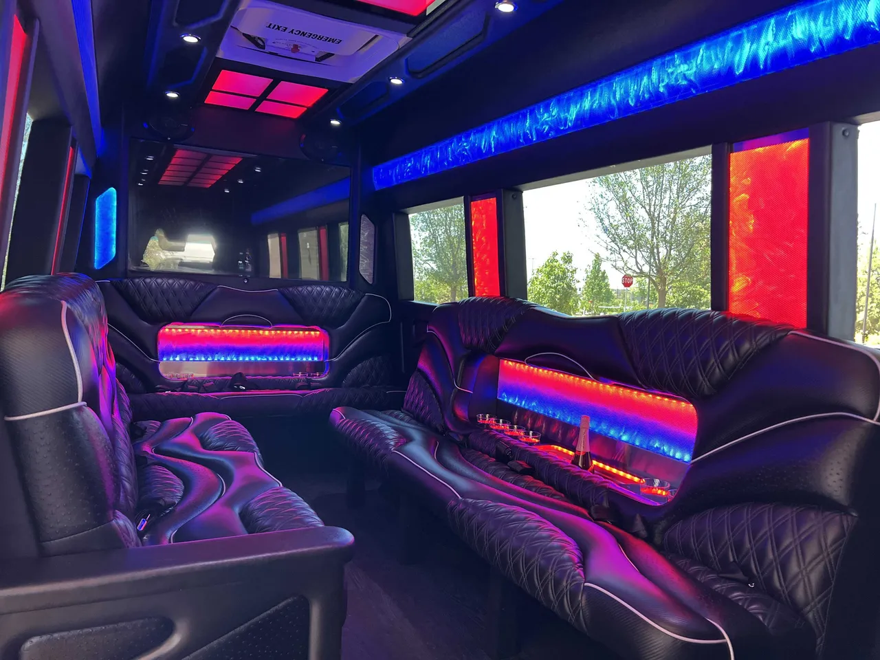 Mercedes Sprinter Limo interior with sofa-style seating, LED accent lighting and LED ceiling lighting, photo 2 for party bus rental in Long Barn, CA