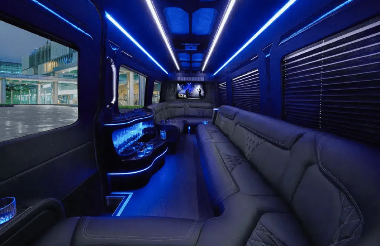 Mercedes-Benz Sprinter Limousine interior with perimeter lounge seating, window shades and LED accent lighting for party bus rental