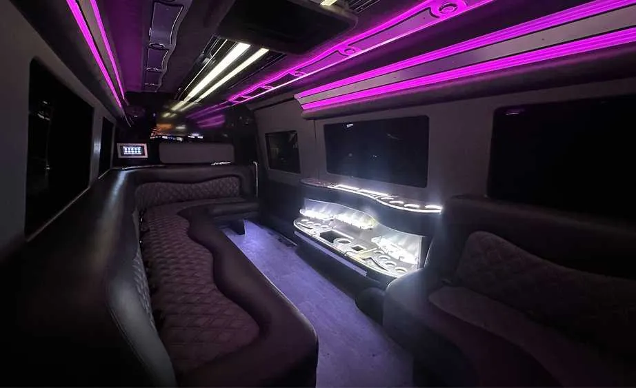 Mercedes Sprinter Limo interior with perimeter lounge seating, LED accent lighting and bar area, photo 3 for party bus rental in Birds Landing, CA