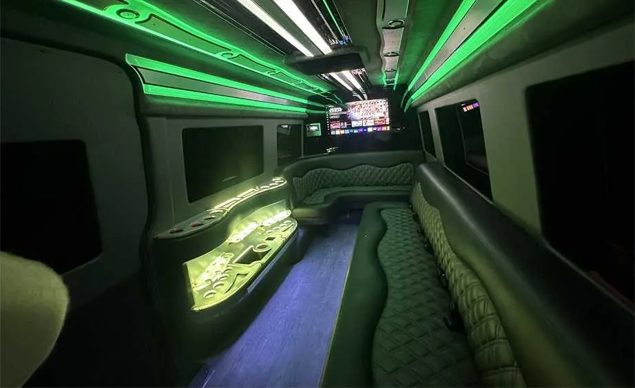 Mercedes Sprinter Limo interior with perimeter lounge seating, LED accent lighting and bar area, photo 4 for party bus rental in Birds Landing, CA