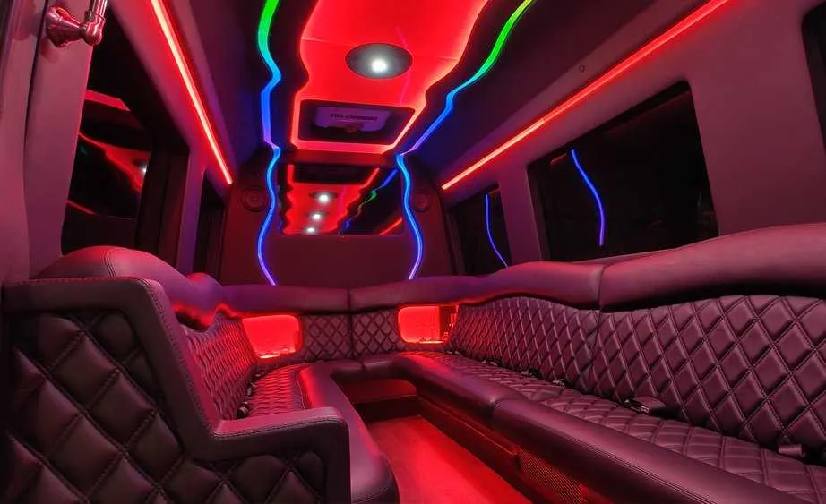 Mercedes Sprinter Limo interior with perimeter lounge seating and LED accent lighting, photo 5 for party bus rental in Birds Landing, CA