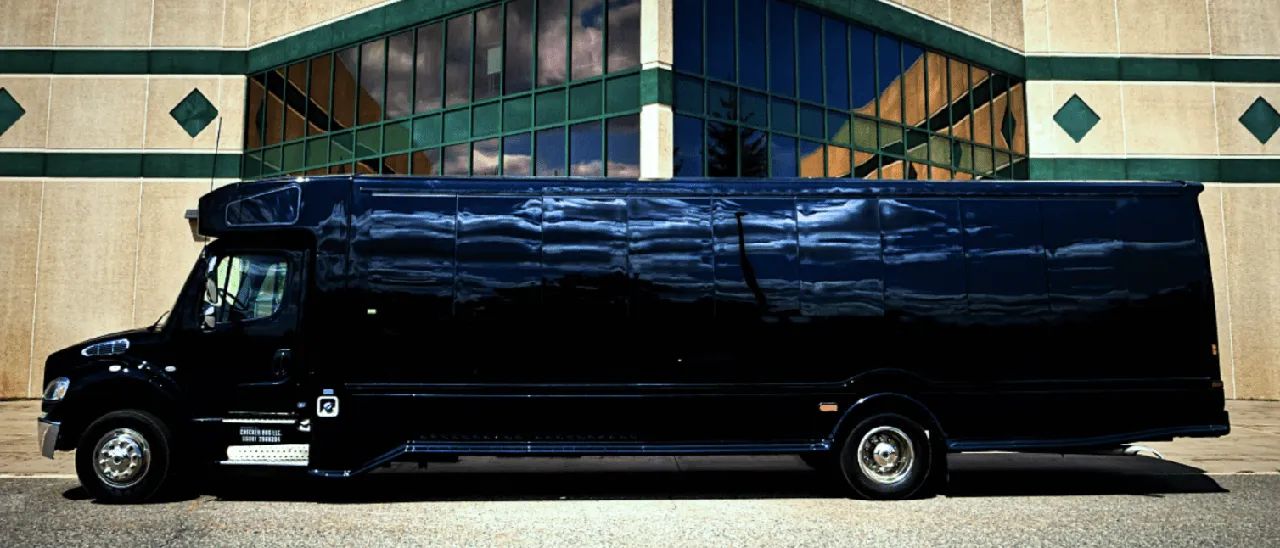 Black 28 Passenger Party Bus exterior with tinted windows for limo rental in Goodhue County, MN