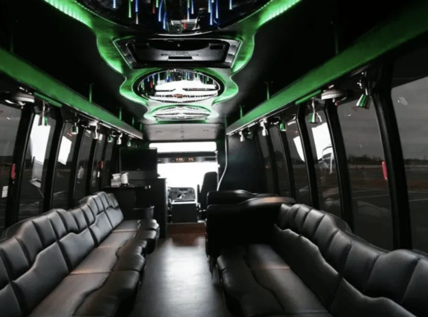 28 Passenger Party Bus interior with perimeter lounge seating, LED accent lighting and LED ceiling lighting for limo rental in Goodhue County, MN